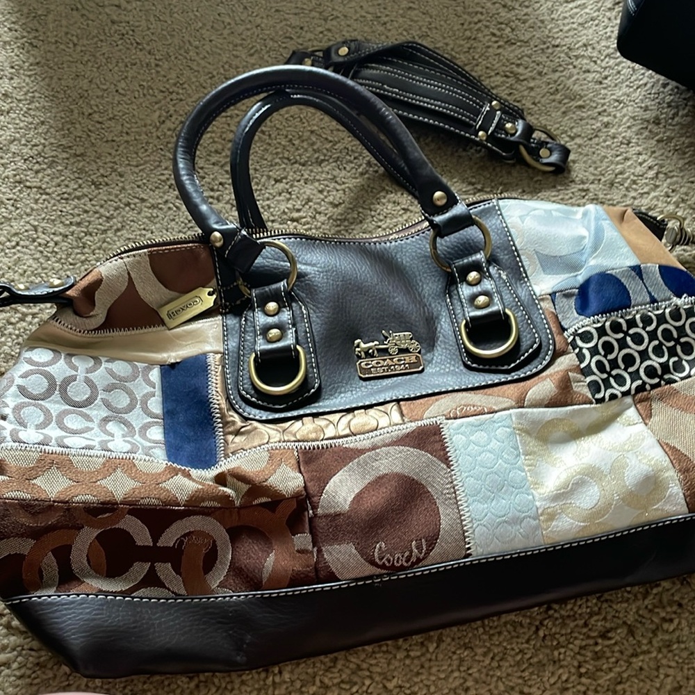 Never worn coach bag with extra strap to turn into cross body